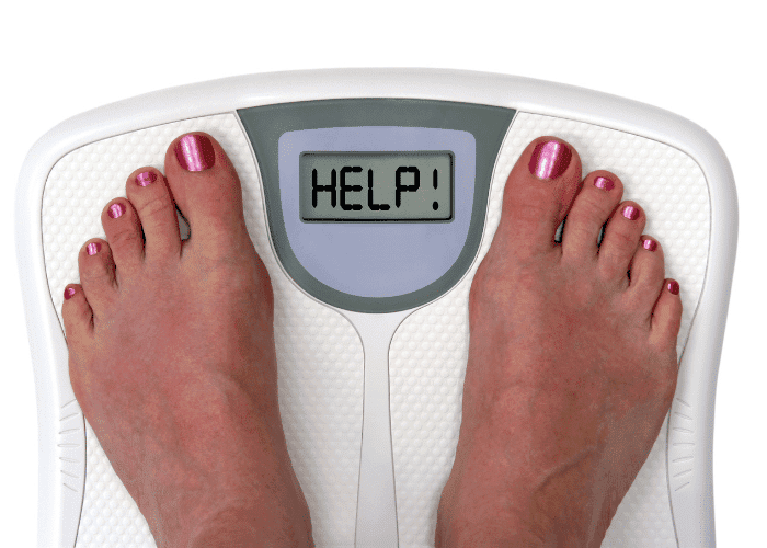 Person's feet on a scale displaying "HELP!" on the digital screen. Painted toenails.